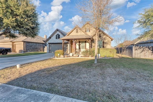 view of front of home with a front yard and covered porch