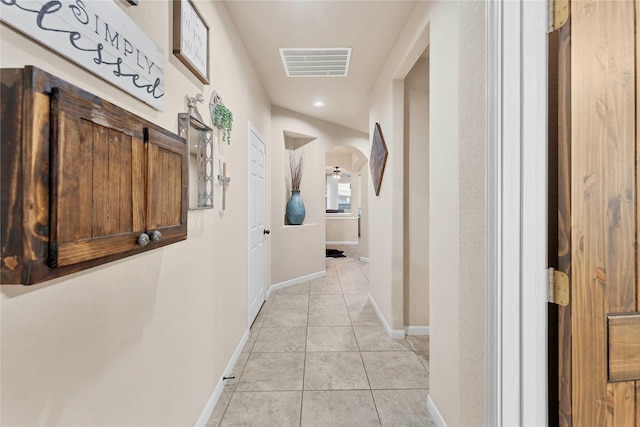 hallway with light tile patterned flooring