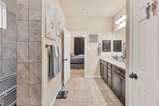 bathroom with tile patterned flooring, vanity, and ceiling fan