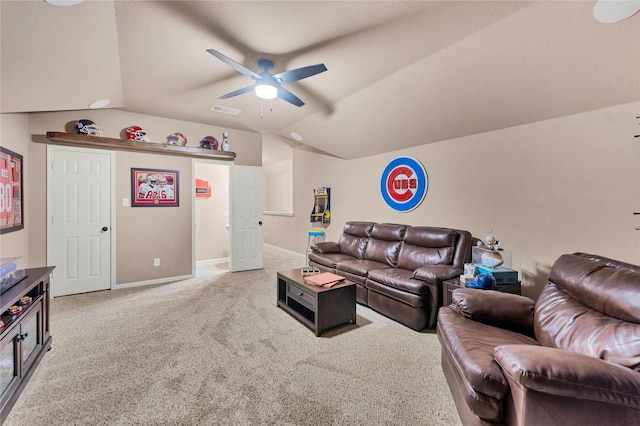 living room featuring carpet flooring, ceiling fan, and lofted ceiling