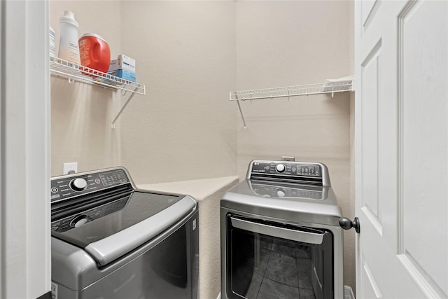 laundry room with separate washer and dryer