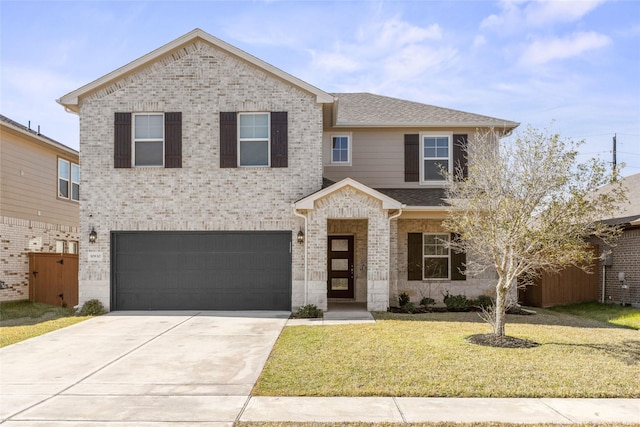 view of front facade featuring a front yard and a garage