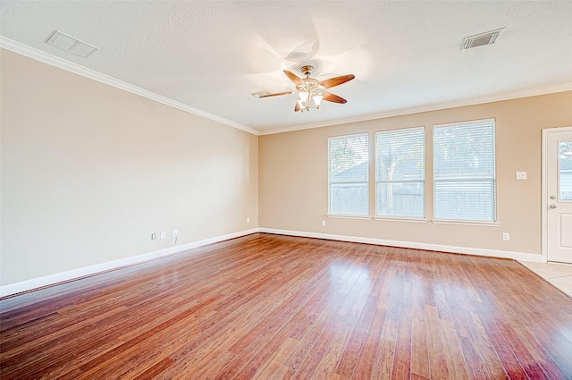 unfurnished room with a textured ceiling, light hardwood / wood-style flooring, ceiling fan, and ornamental molding