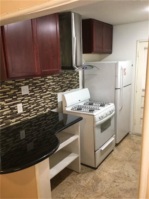 kitchen featuring white appliances and tasteful backsplash