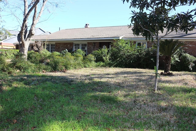 exterior space with a front lawn