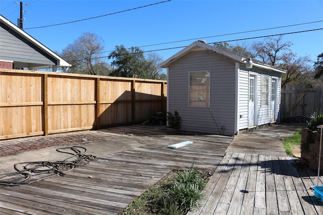 wooden terrace with an outbuilding