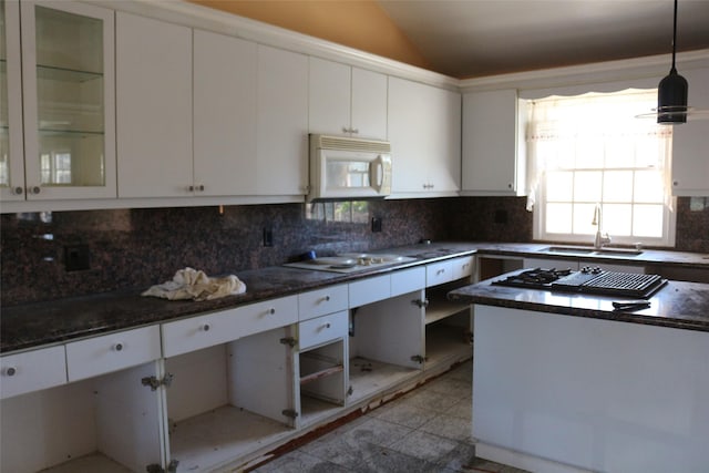 kitchen featuring white cabinetry, sink, and white appliances