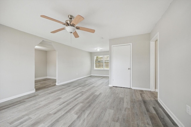 unfurnished living room with ceiling fan and light hardwood / wood-style floors