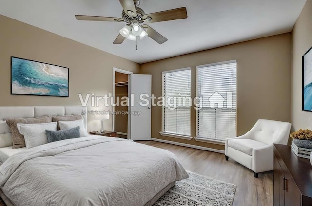 bedroom with ceiling fan and light hardwood / wood-style floors