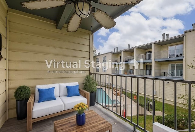 balcony featuring ceiling fan and an outdoor hangout area