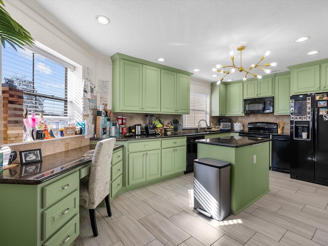 kitchen with plenty of natural light, green cabinets, a kitchen island, and black appliances