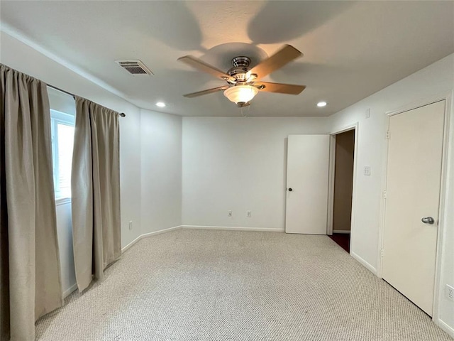 carpeted empty room with ceiling fan