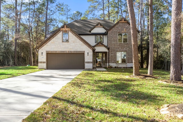 view of front of house with a garage and a front lawn