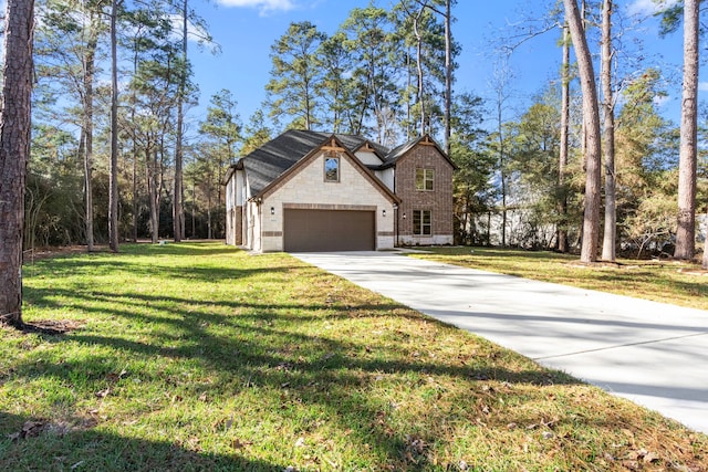 view of front of house featuring a front yard and a garage