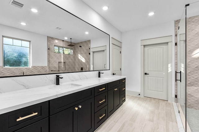 bathroom featuring vanity and walk in shower