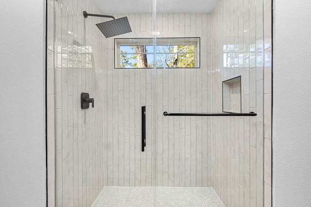 bathroom featuring an enclosed shower