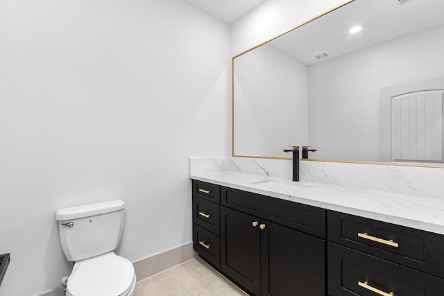 bathroom with tile patterned floors, vanity, and toilet