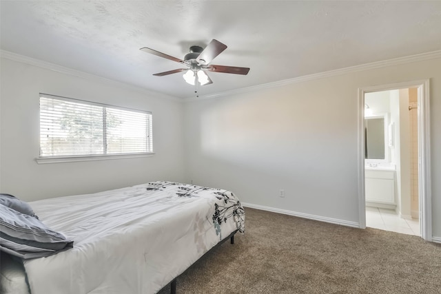 carpeted bedroom with crown molding, ceiling fan, and connected bathroom