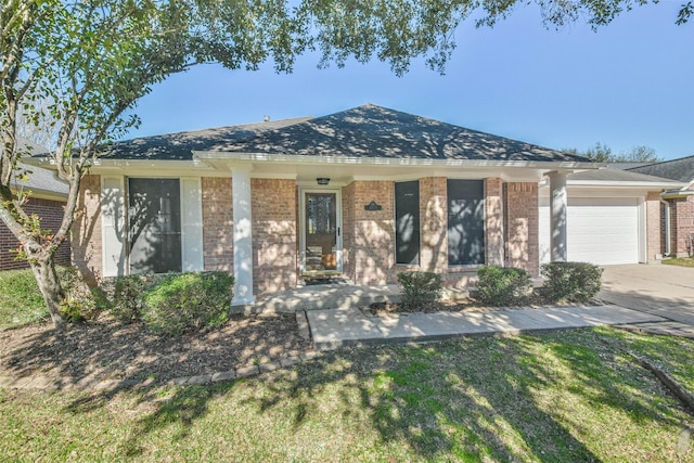 ranch-style house featuring a garage and a front yard