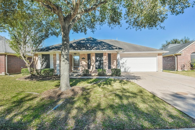 single story home featuring a garage and a front lawn