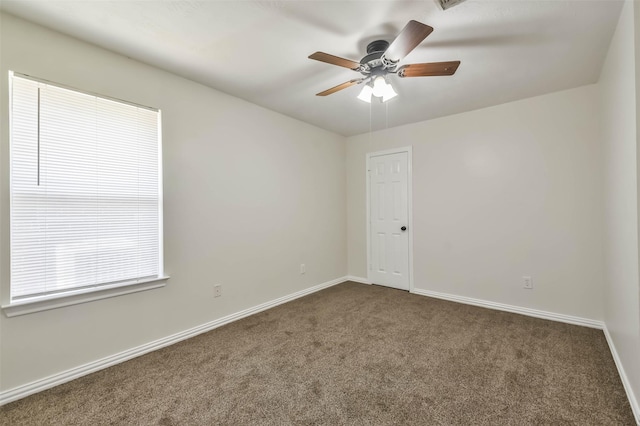 carpeted empty room with ceiling fan