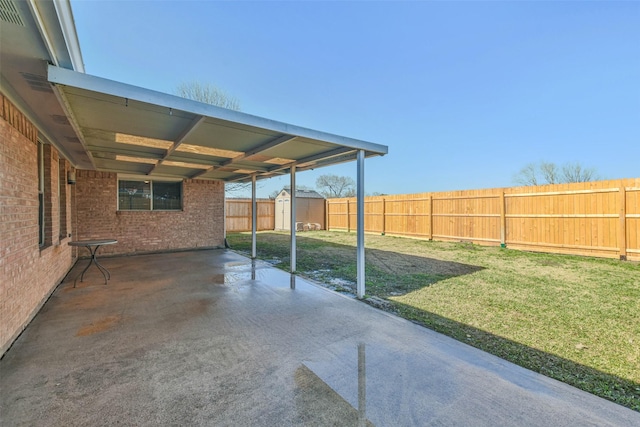 view of patio / terrace with a shed