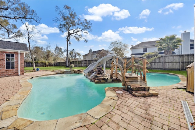 view of swimming pool featuring a water slide