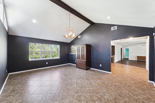 interior space featuring lofted ceiling with beams and an inviting chandelier