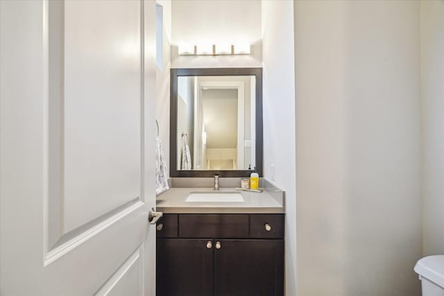 bathroom with vanity and toilet