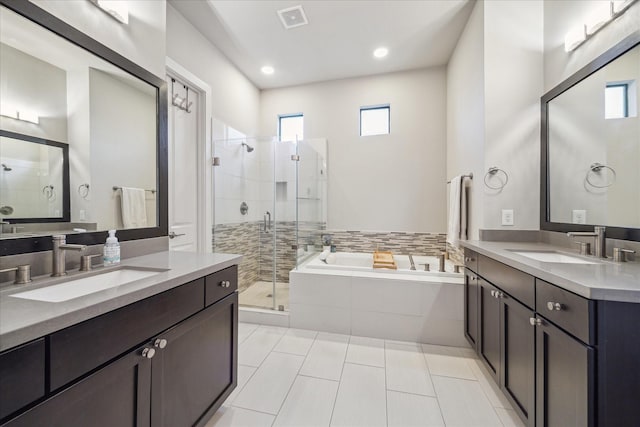 bathroom featuring tile patterned flooring, vanity, and independent shower and bath