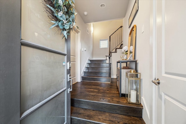 stairs with hardwood / wood-style floors