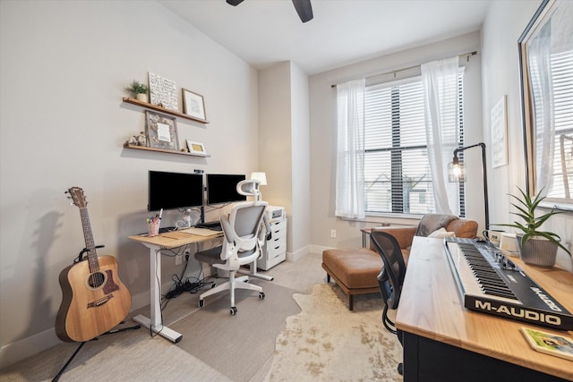 office area featuring ceiling fan and light colored carpet