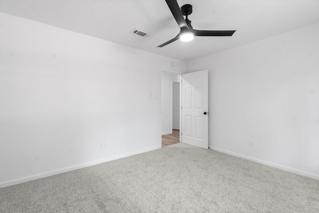 empty room with light carpet and ceiling fan