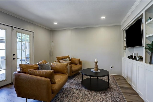 living room featuring dark hardwood / wood-style flooring, ornamental molding, and french doors