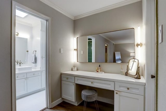 bathroom featuring hardwood / wood-style floors, vanity, and ornamental molding