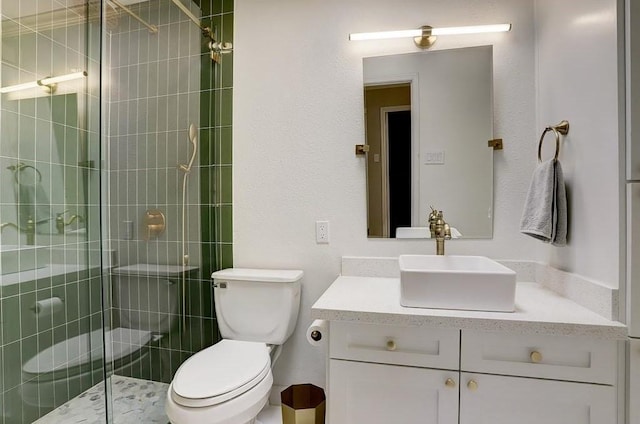 bathroom featuring vanity, toilet, and walk in shower