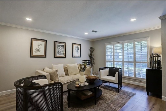 living room featuring dark hardwood / wood-style flooring and ornamental molding