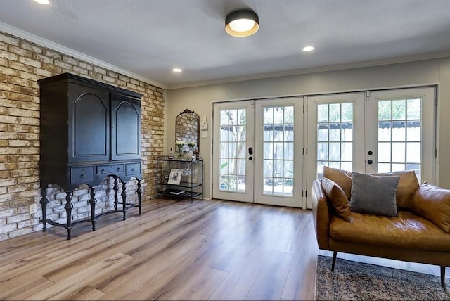 doorway to outside with french doors, a healthy amount of sunlight, and wood-type flooring