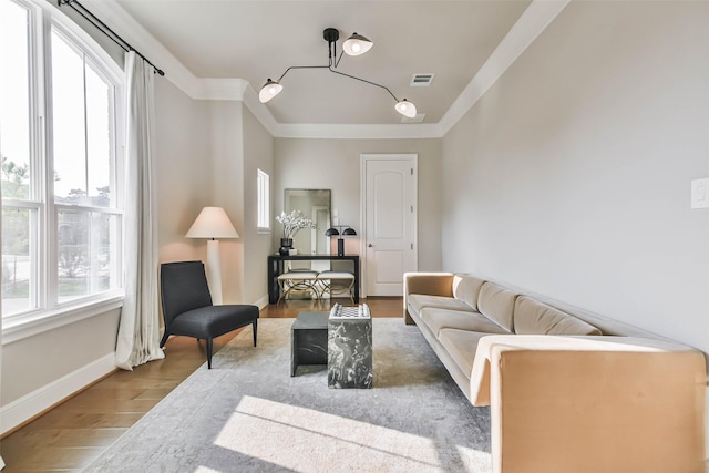 living room with crown molding and light hardwood / wood-style floors