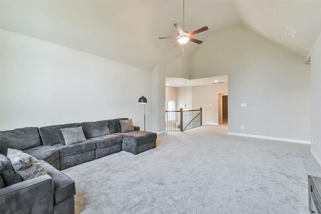 carpeted living room featuring ceiling fan and high vaulted ceiling