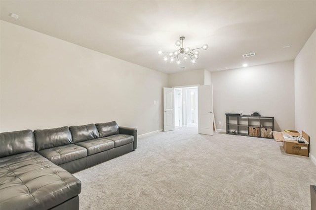 living room with carpet and an inviting chandelier