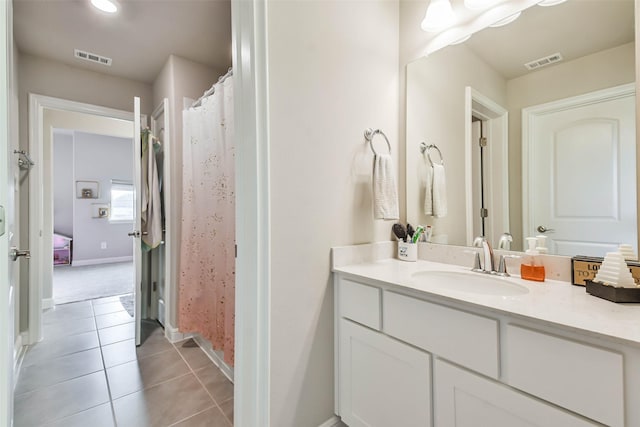 bathroom featuring tile patterned floors and vanity