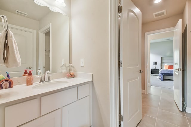 bathroom featuring tile patterned floors and vanity