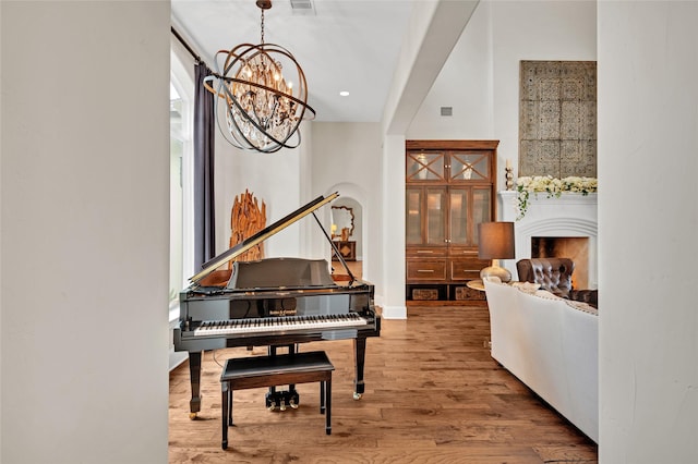 interior space with wood-type flooring and a chandelier