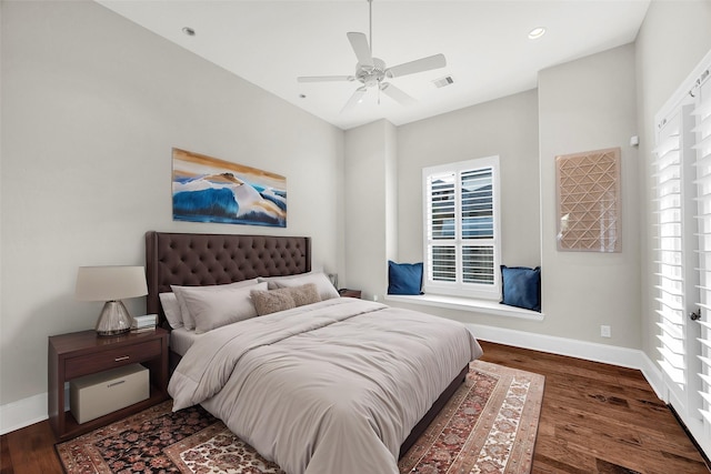 bedroom featuring ceiling fan and dark hardwood / wood-style flooring