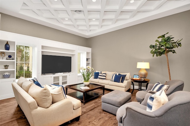 living room with beam ceiling, coffered ceiling, and wood-type flooring