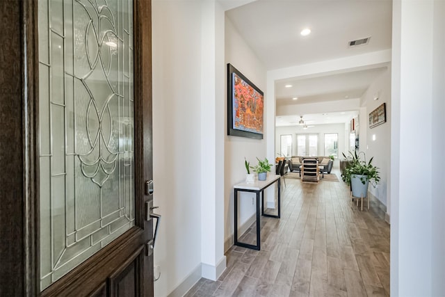 entryway with ceiling fan and light wood-type flooring