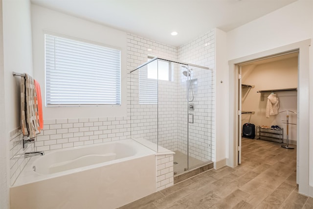 bathroom with shower with separate bathtub