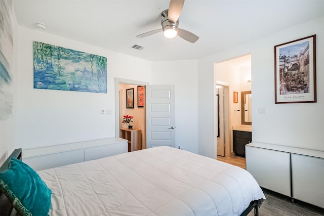 bedroom featuring ceiling fan, wood-type flooring, and connected bathroom