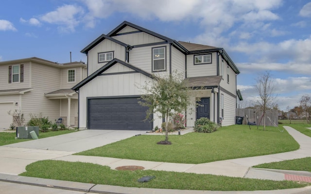 view of front facade featuring a front yard and a garage